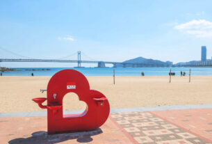 Busan Gwangan bridge taken from Gwangalli beach in brightday with blue sky .